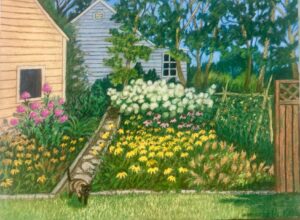 Cottage garden with colorful flowers and cat