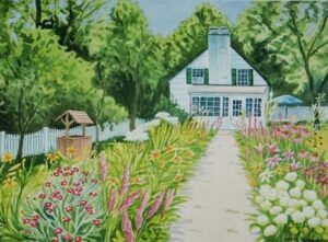 White cottage with flower-lined garden path