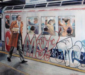 Man in coat walking past graffiti train.