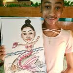 Girl holding a mermaid caricature.
